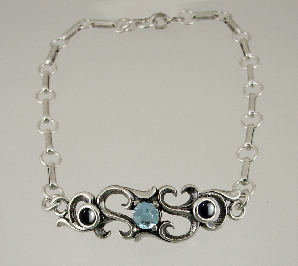 Sterling Silver Bracelet With Faceted Blue Topaz And Hematite
